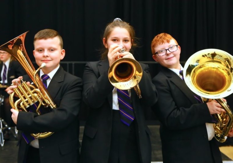 Other image for Students blowing their own trumpets...